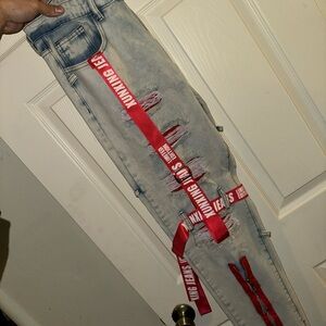 Distressed Denim Jeans with Red Accents